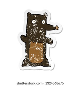 retro distressed sticker of a cartoon black bear