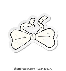 retro distressed sticker of a cartoon bow tie