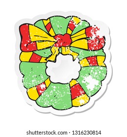 retro distressed sticker of a cartoon christmas wreath