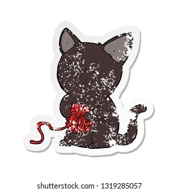 retro distressed sticker of a cartoon cute black cat playing with ball of yarn