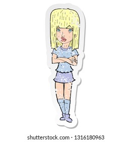 retro distressed sticker of a cartoon girl with crossed arms