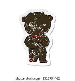 retro distressed sticker of a cartoon little black bear