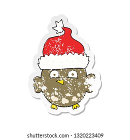 retro distressed sticker of a cartoon owl wearing christmas hat