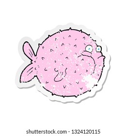 retro distressed sticker of a cartoon puffer fish