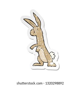 retro distressed sticker of a cartoon rabbit
