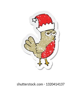 retro distressed sticker of a cartoon robin in christmas hat