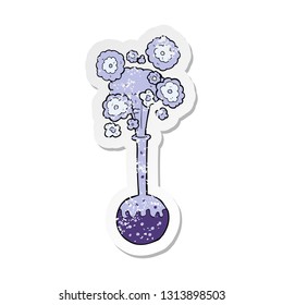 retro distressed sticker of a cartoon science experiment