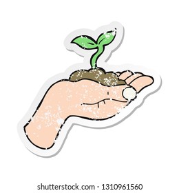 retro distressed sticker of a cartoon seedling growing held in hand