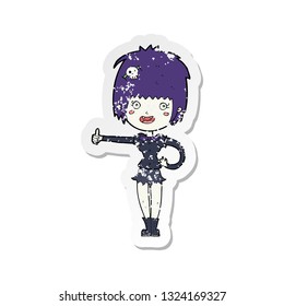 retro distressed sticker of a cartoon vampire girl giving thumbs up sign