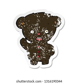 retro distressed sticker of a cartoon waving black bear cub