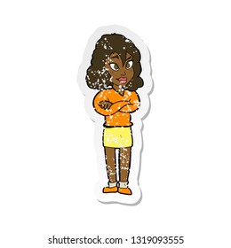 retro distressed sticker of a cartoon woman with crossed arms