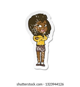 retro distressed sticker of a cartoon woman with crossed arms