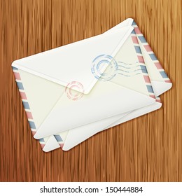 Retro envelopes on wooden background