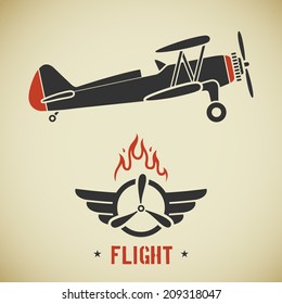 Retro flat looking plane and emblem with wings, flame and propeller