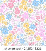 Retro floral pattern in small decorative flowers. Small blue, yellow pink flowers. White background. Ditsy print. Floral seamless background ditsy pattern in small cute wild flowers.