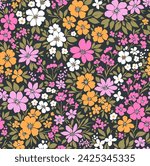 Retro floral pattern in small decorative flowers. Small pink, white, yellow flowers. Black background. Ditsy print. Floral seamless background ditsy pattern in small cute wild flowers.