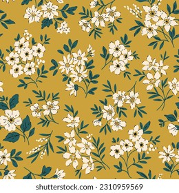 Retro floral pattern in small flowers. Small white flowers. Gold yellow mustard background. Ditsy print. Floral seamless background. Elegant template for fashion prints. Stock pattern.