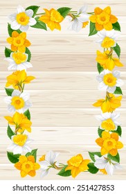 Marco retro de daffodias flores sobre fondo de madera