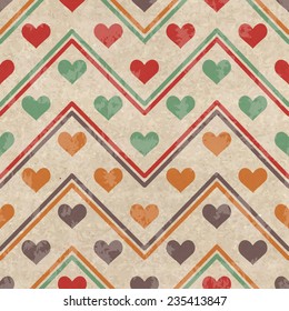 Retro geometric seamless pattern with colorful hearts shape on a vintage cardboard background