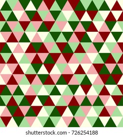 Retro geometric triangle seamless repeating background pattern in vector format. Mosaic of reds, pink, greens, in a Christmas holiday color