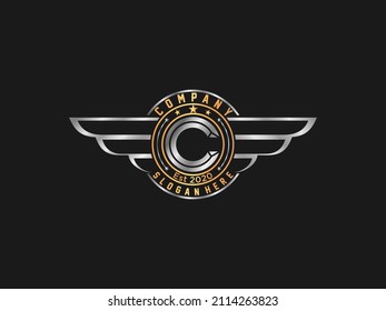 Retro Gold wings badge with letter C . vintage logo vector design element