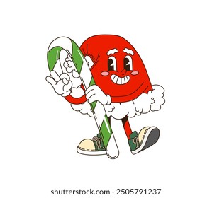 Retro groovy Christmas Santa hat character holding candy cane, striking festive pose. Isolated cartoon vector xmas cap with cheerful expression and traditional red and white colors exudes holiday vibe