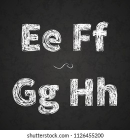 Retro hand drawn alphabet letters drawing with white chalk on black chalkboard E, F, G, H letters
