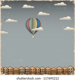 Retro hot air balloon and town from paper. Creative vector eps 10