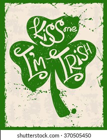 Retro illustration of isolated green shamrock leaf silhouette. Typography St. Patrick's day poster with text kiss me I'm Irish.