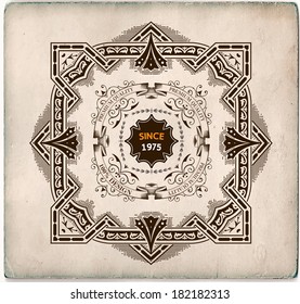 Retro label with heraldic shield and floral details.