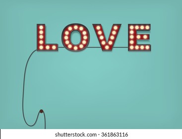 Retro Light Bulb Love Sign on an Pale Blue Wall with a cable hanging down, and glowing little bulbs. Lots of room for your text: Copy Space