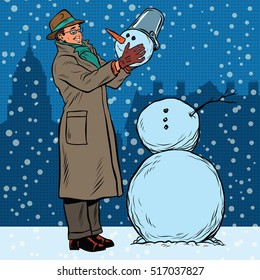 Retro man and snowman, pop art retro vector illustration. Winter and snow