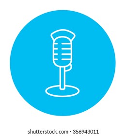 Retro microphone line icon for web, mobile and infographics. Vector white icon on the light blue circle isolated on white background.