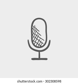 Retro microphone sketch icon for web and mobile. Hand drawn vector dark grey icon on light grey background.