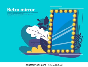 Retro mirror with burning lights on the perimeter of the frame, with vegetation in the background