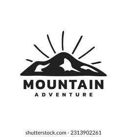 Retro mountain logo with sun rays for outdoor adventure branding