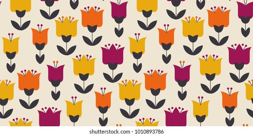 Retro orange and yellow color 60s flower motif. Geometric floral seamless pattern.  vector illustration