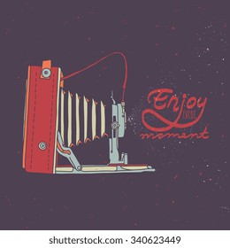 Retro photo camera with "Enjoy every moment" quote