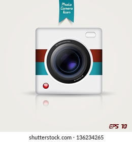 Retro photo camera icon. Vector