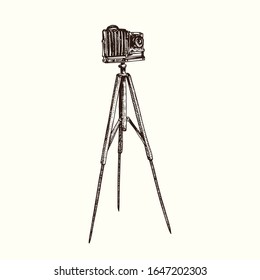 Retro photo camera on tripod, hand drawn doodle, drawing in gravure style, sketch illustration, design element