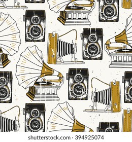 Retro photo camera and record player. Vector seamless pattern
