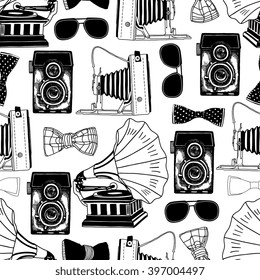 Retro photo camera, record player, glasses and bow tie. Vector seamless pattern