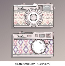 Retro photo cameras set. Vector illustration. Vintage cameras with ornaments. Camera with aztec style pattern.