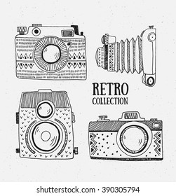 Retro photo cameras set. Vector illustration. Vintage cameras with ornaments. Hipster vector set.