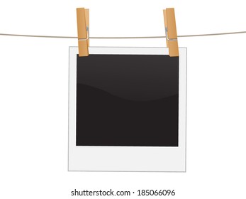 Retro photo frame hanging on a rope held by clothespins, isolated on white background,