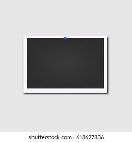 Retro photo frame with shadow on blue pin isolated on a white background