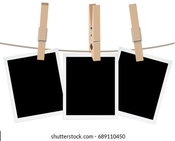Retro photo frames hung on a rope with wooden clothespins.