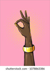 Retro pop art african womans hand showing OK sign with golden bracelet Bright comic style placard with Okay hand gesture. Vector illustration.