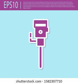 Retro purple Construction jackhammer icon isolated on turquoise background.  Vector Illustration