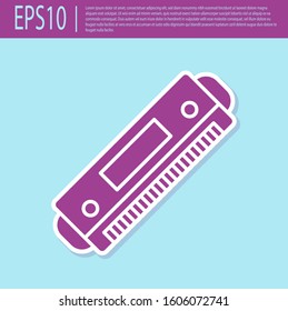 Retro purple Harmonica icon isolated on turquoise background. Musical instrument.  Vector Illustration